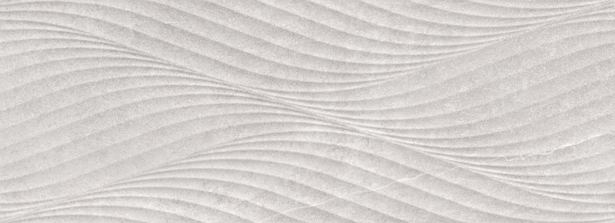 Reserve Silver Wave ceramic wall tile with a flowing, sculpted surface in a soft silver hue.