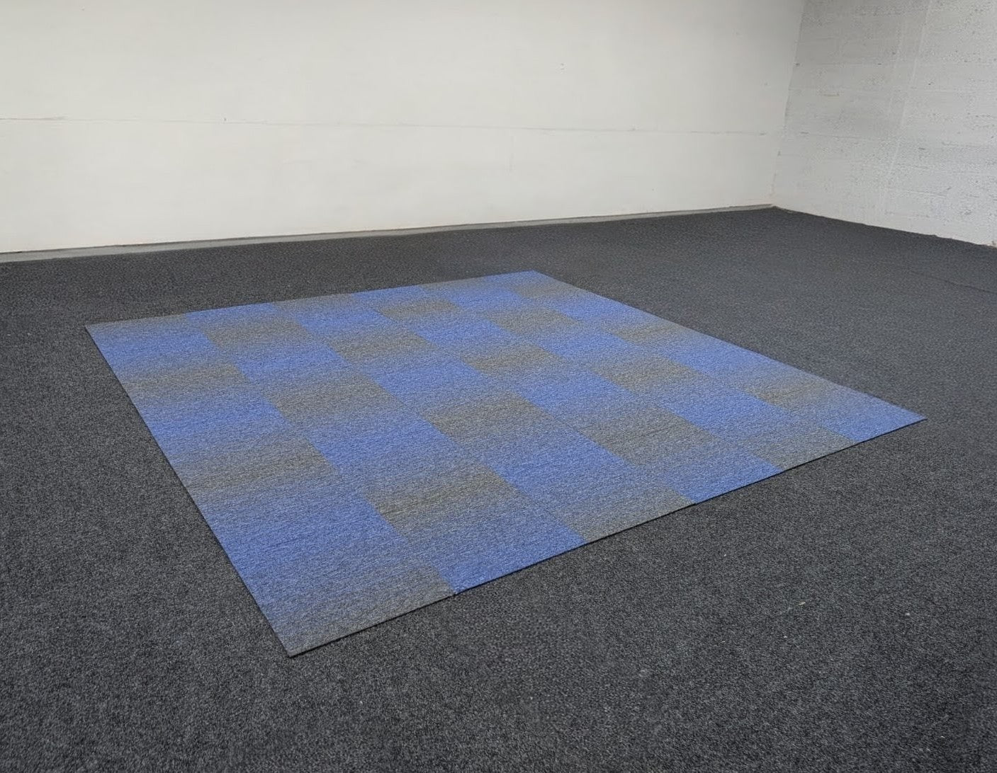 Burmatex Tivoli Mist Nordic Fjord Carpet Tile 50x50cm in blue and grey pattern, showcasing low carbon design.