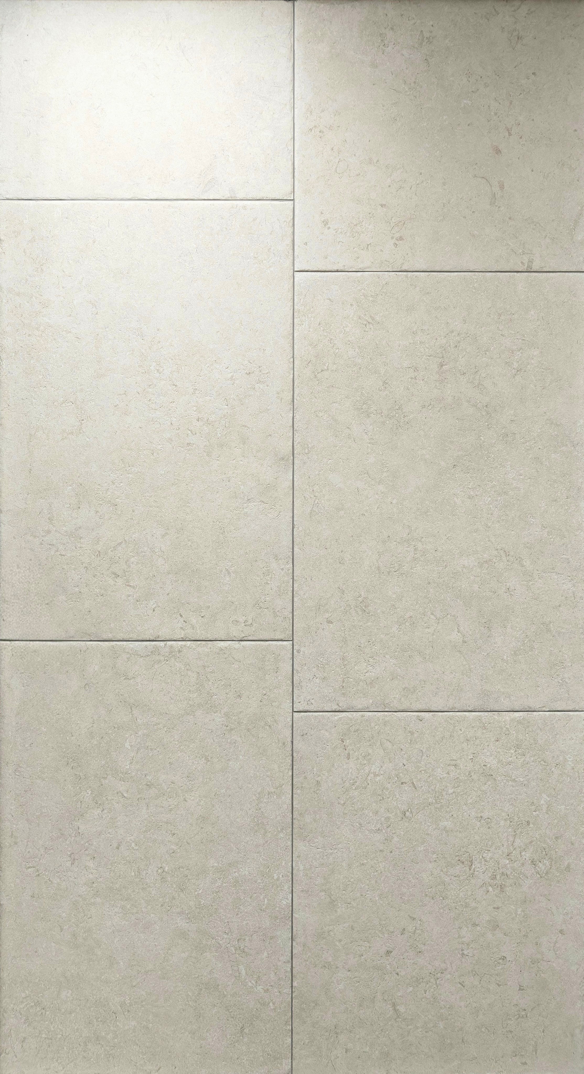 Castleton Ivory porcelain tiles in a subtle stone-like texture, showcasing refined ivory tones for contemporary spaces.