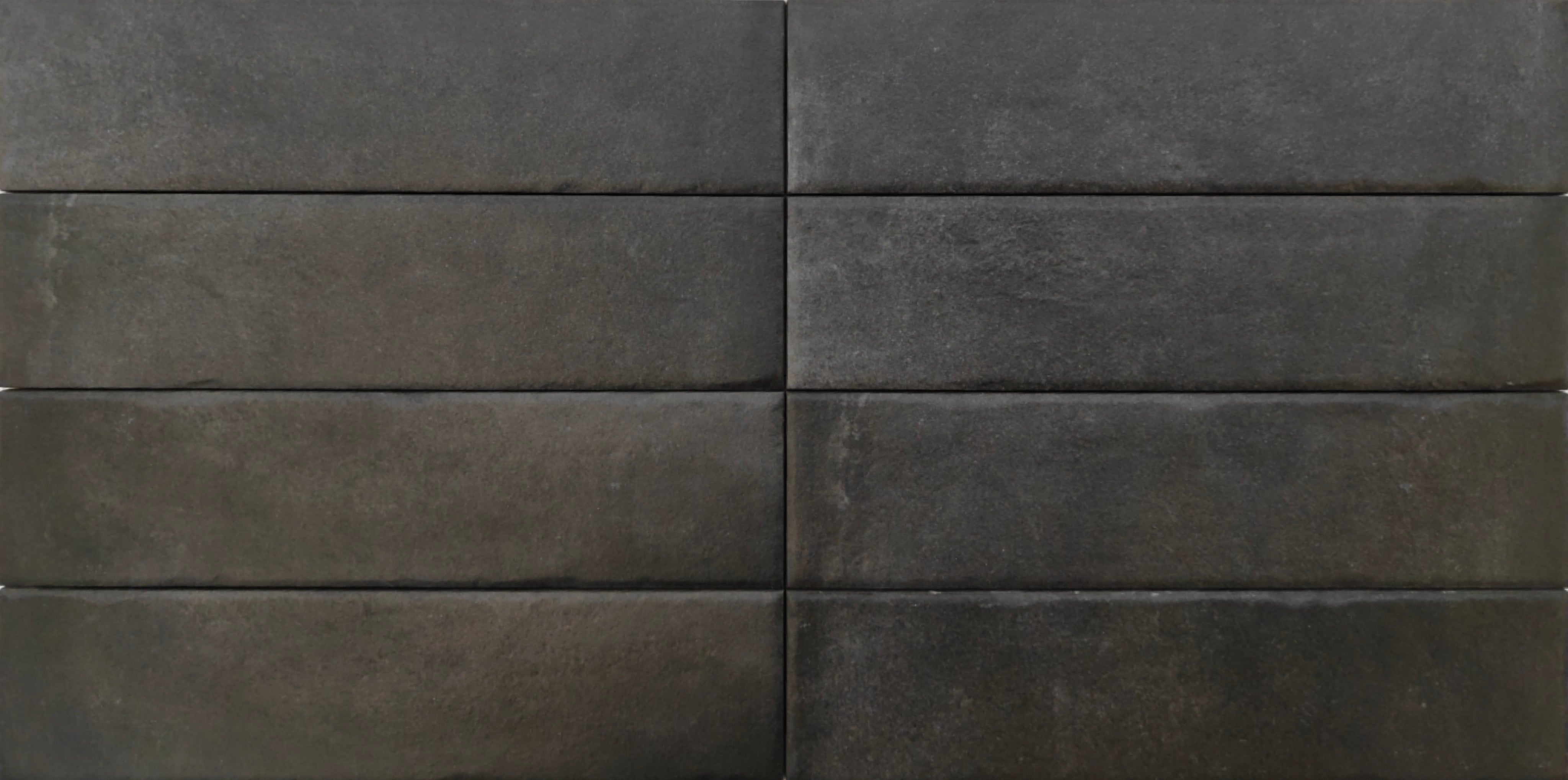 Rewind Peltro tile in a deep smoky tone showcasing a worn-in industrial look, perfect for modern interiors.