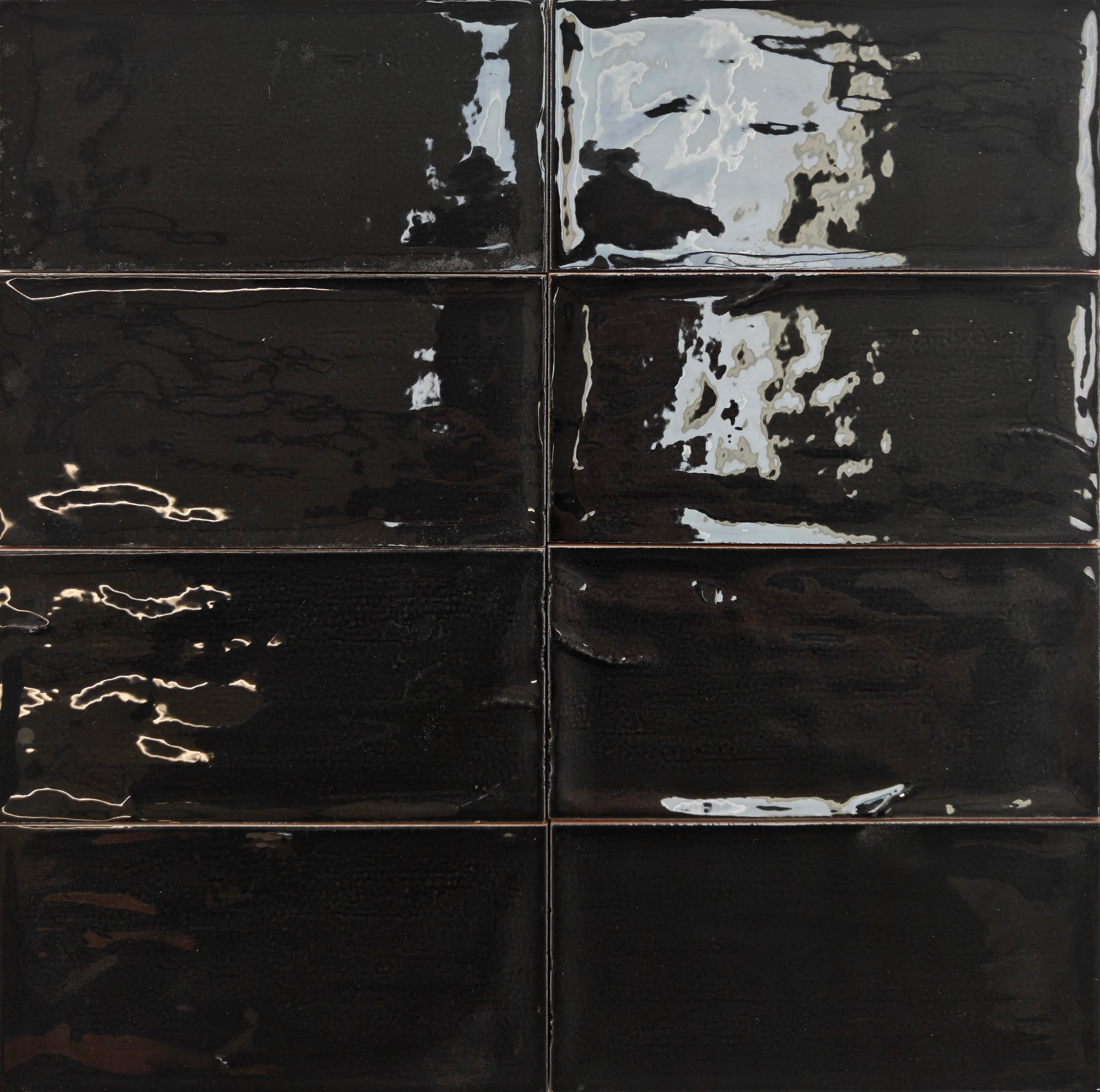 Rustico Black wall tile 7.5x15cm with glossy finish and rippled surface, ideal for modern interiors.
