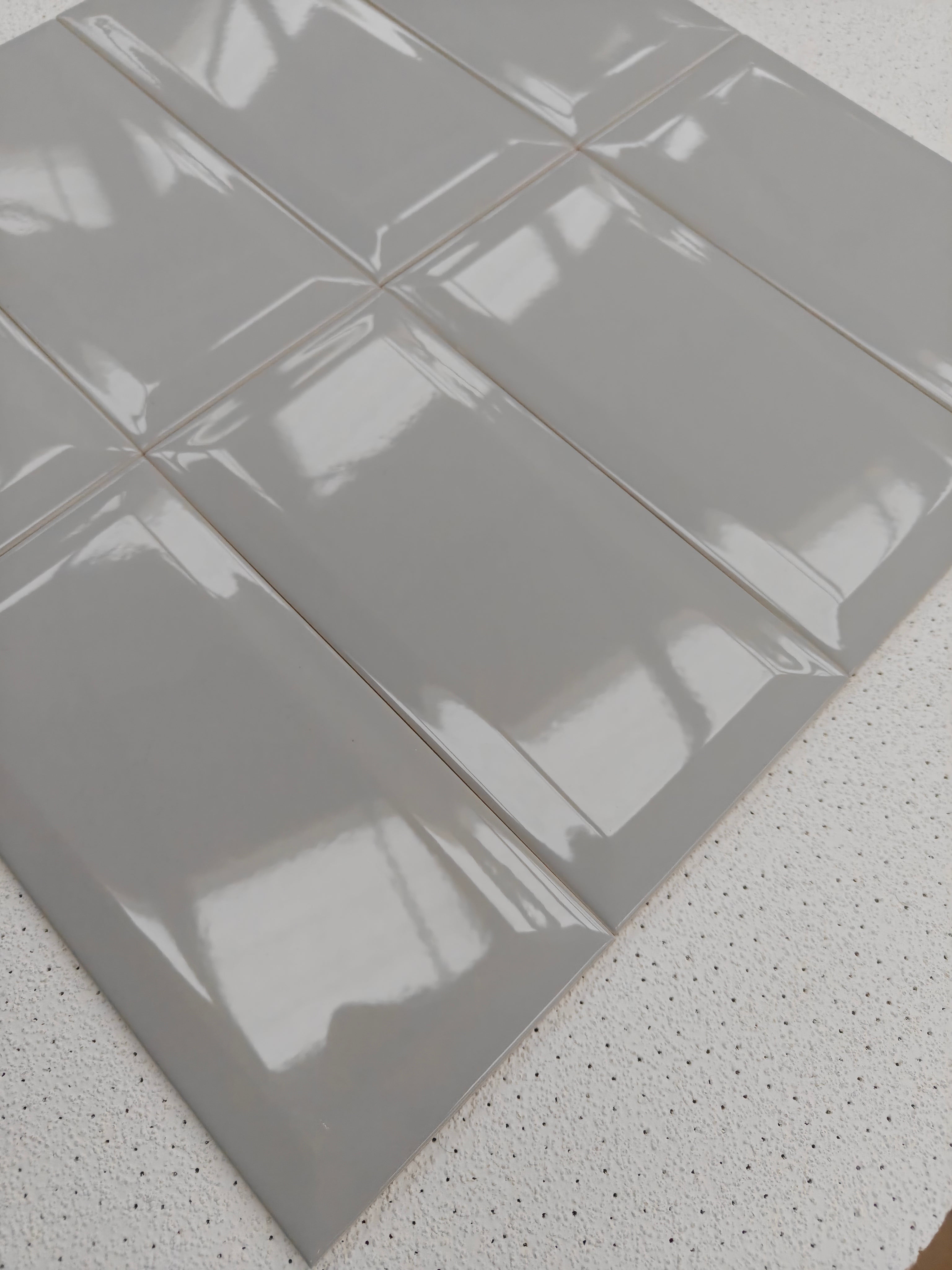 Maco Metro Smoke ceramic wall tiles in gloss finish, 10x20cm size, showcasing soft smoke-grey color.