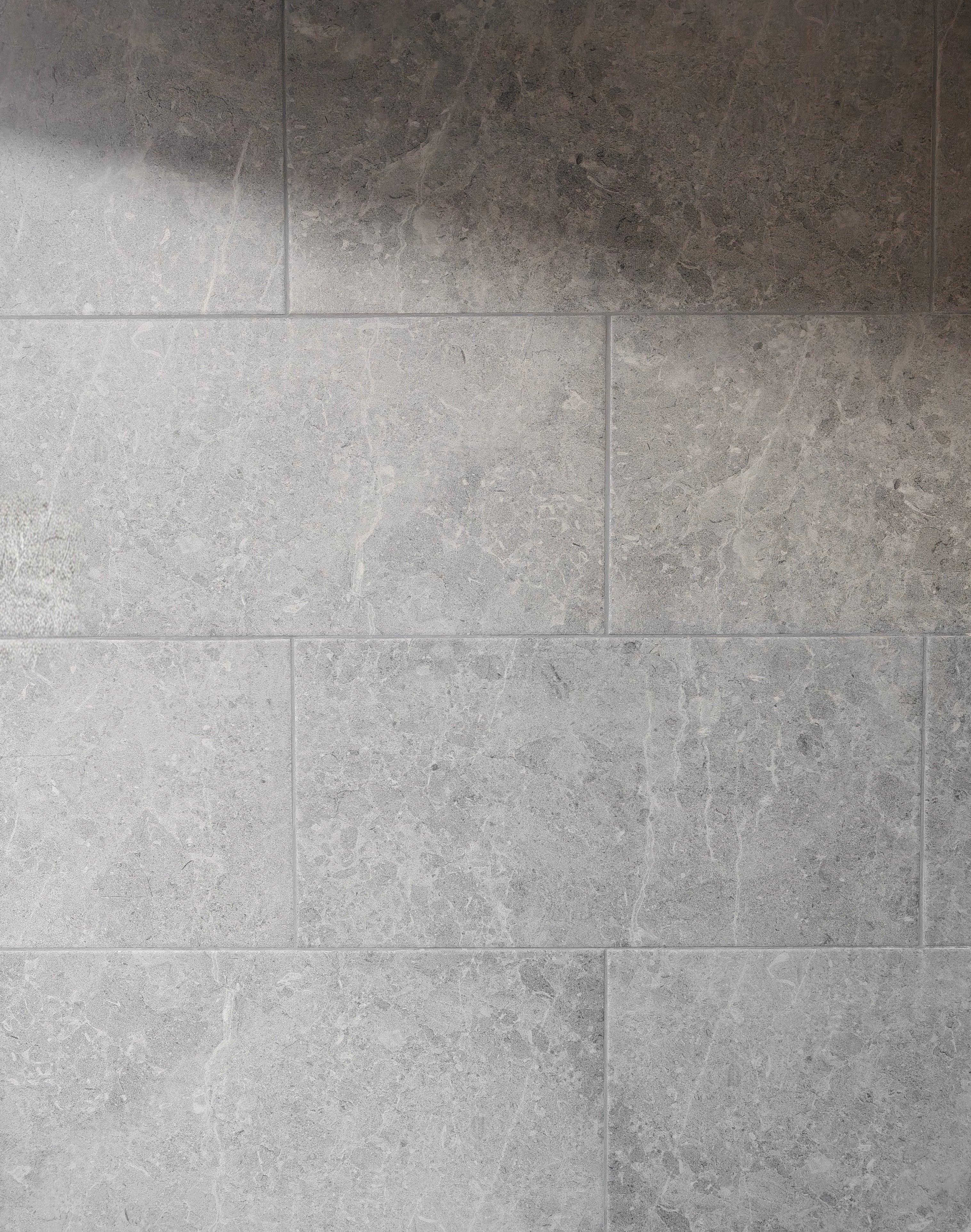 Botticino Light Grey 30x60cm matt porcelain tile showcasing soft light grey tones and organic veining.