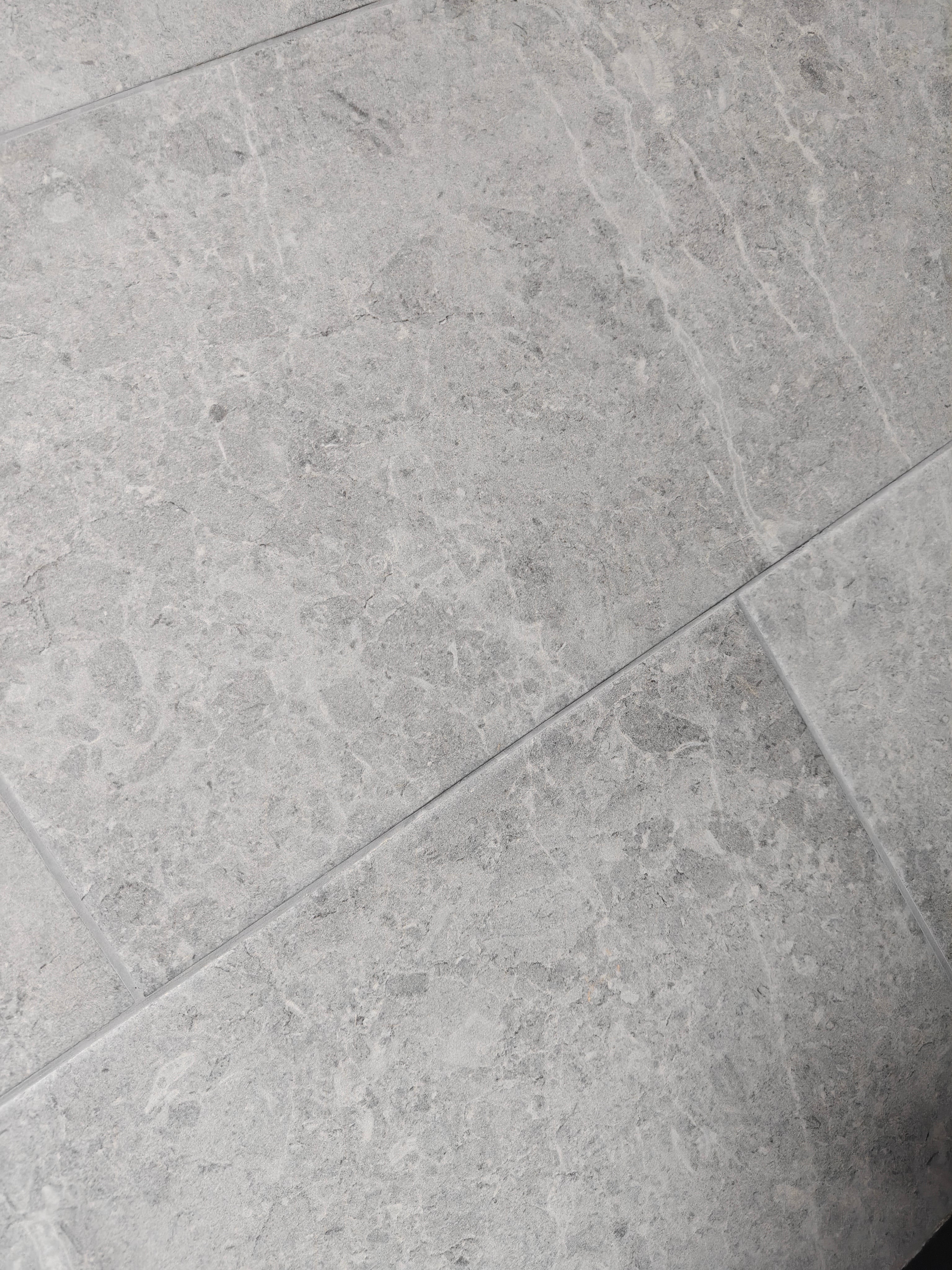 Botticino Light Grey porcelain tile surface with subtle veining and a matt finish, 30x60cm size.