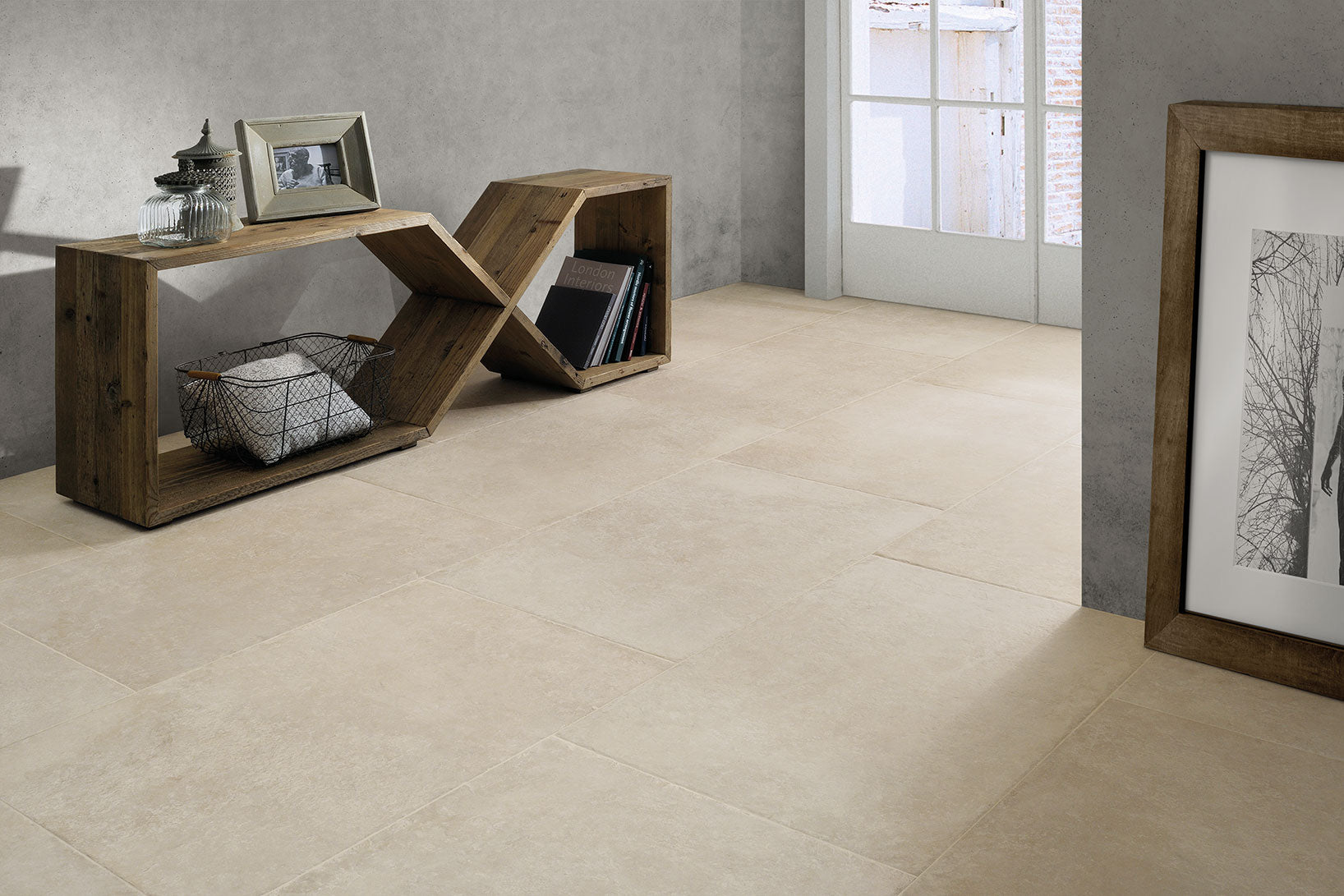 Castleton Ivory porcelain tiles displayed in a stylish interior with wood furniture and natural light.