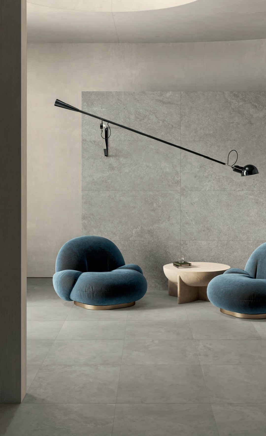 Frame Dust 80x80cm beautifully styled in a modern interior featuring soft blue chairs and contemporary lighting.