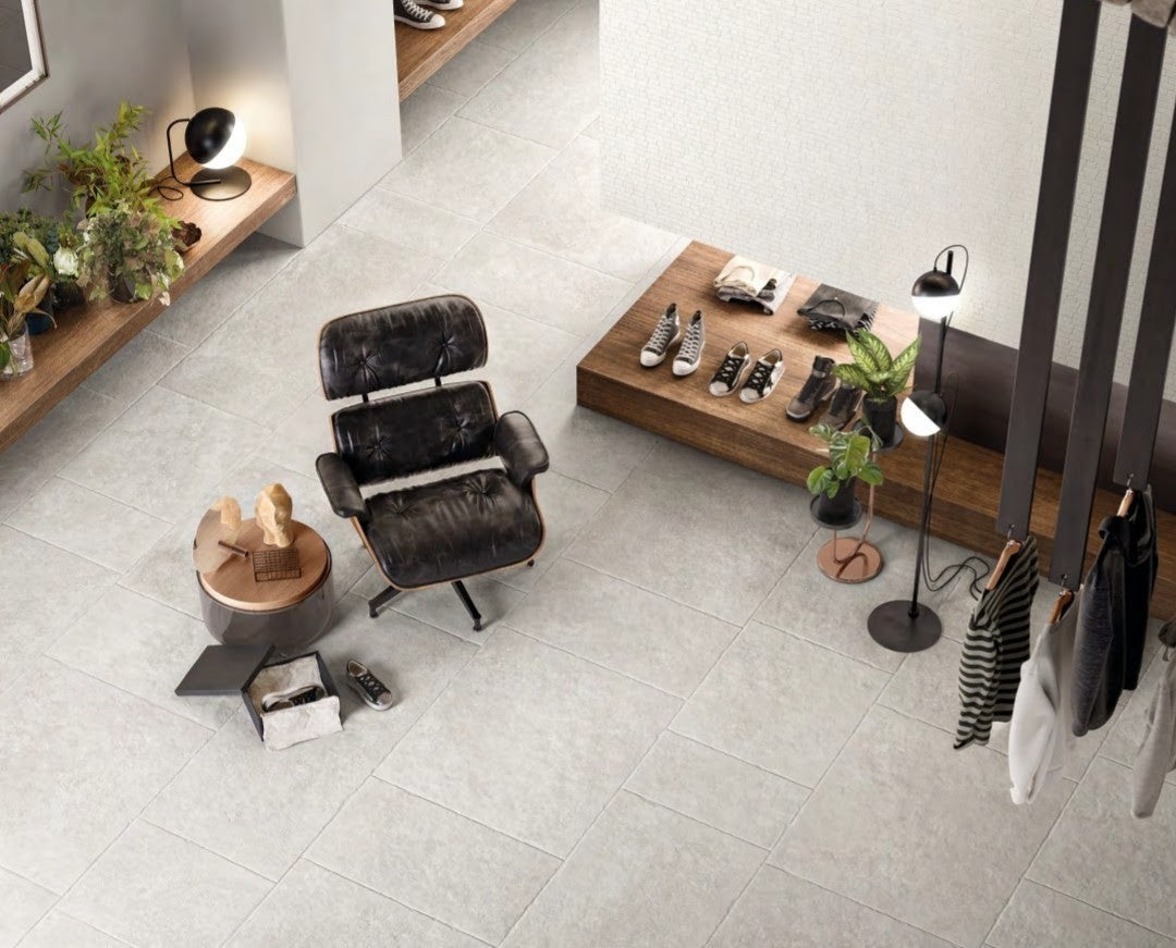 Chateau Blanco 80x80cm porcelain tile flooring showcasing sophisticated interior design with stylish furniture.