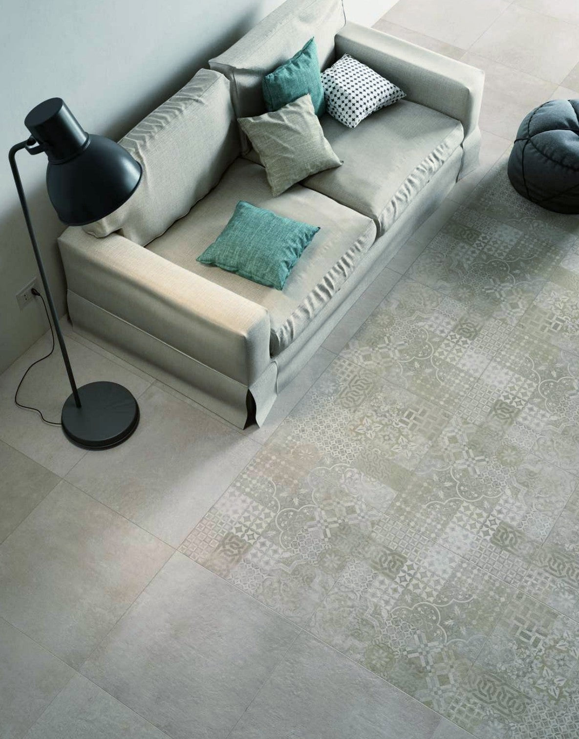 Stylish living room showcasing Plaster Decor Greige tiles with sofa and decorative cushions.