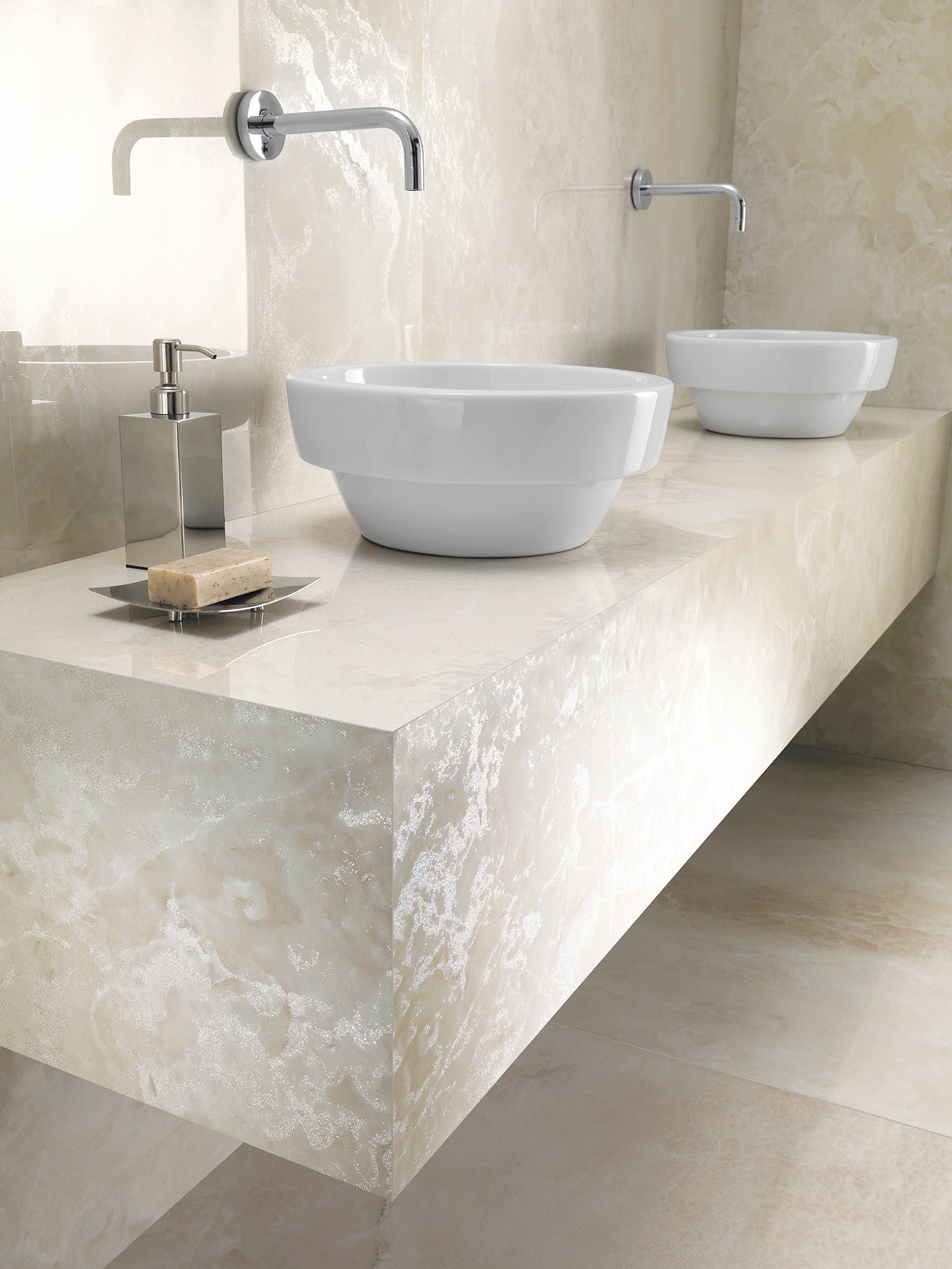 Onyx Diamond porcelain tile surface with two white wash basins and modern faucet in an elegant bathroom setting.